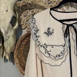 Elegant cream and black top